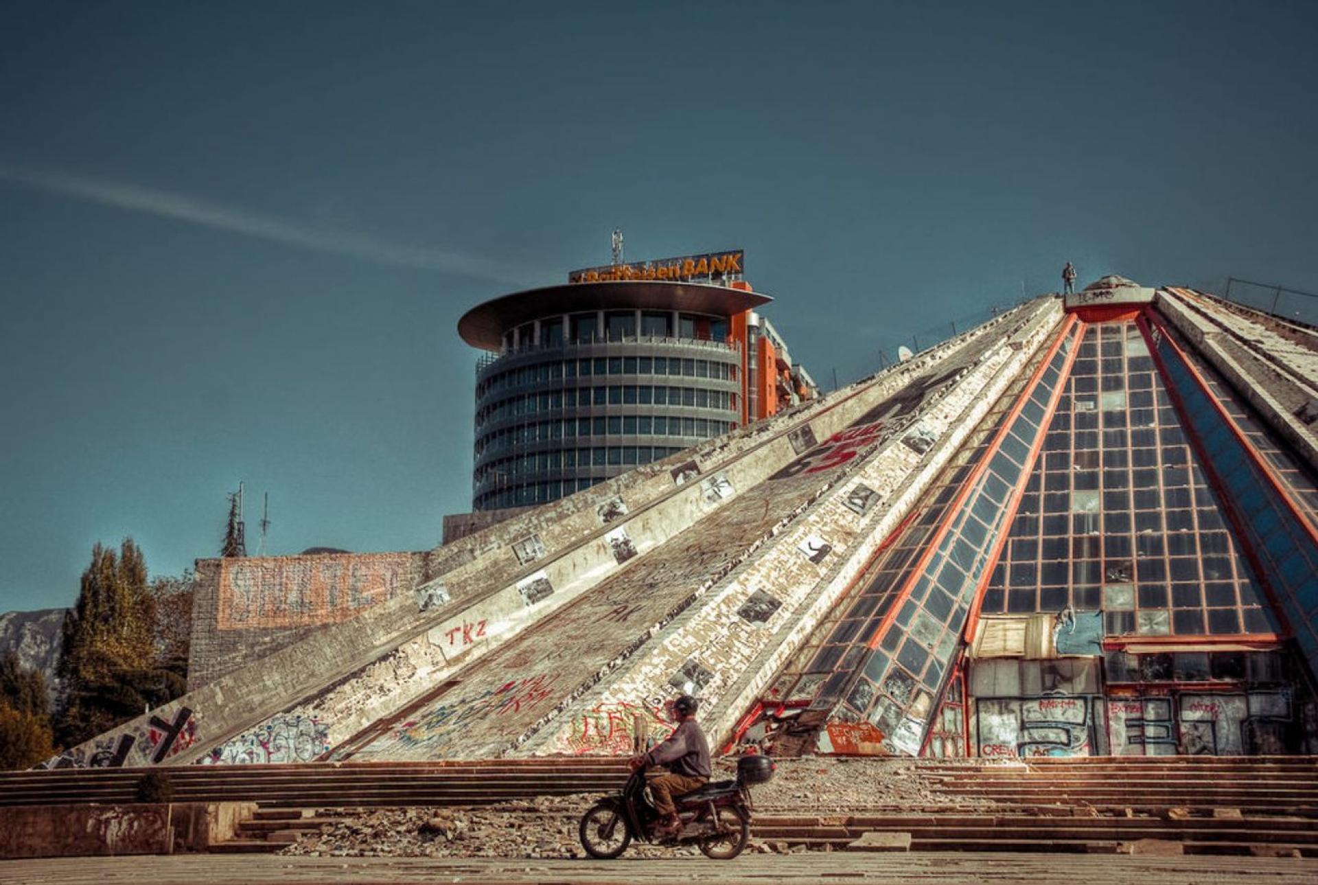 The pyramid in Tirana was constructed after the death of communist leader Enver Hoxha in 1988. The building and the square has today no maintenance, no function or change has been implemented and is used only as a transit space for people only to pass through.