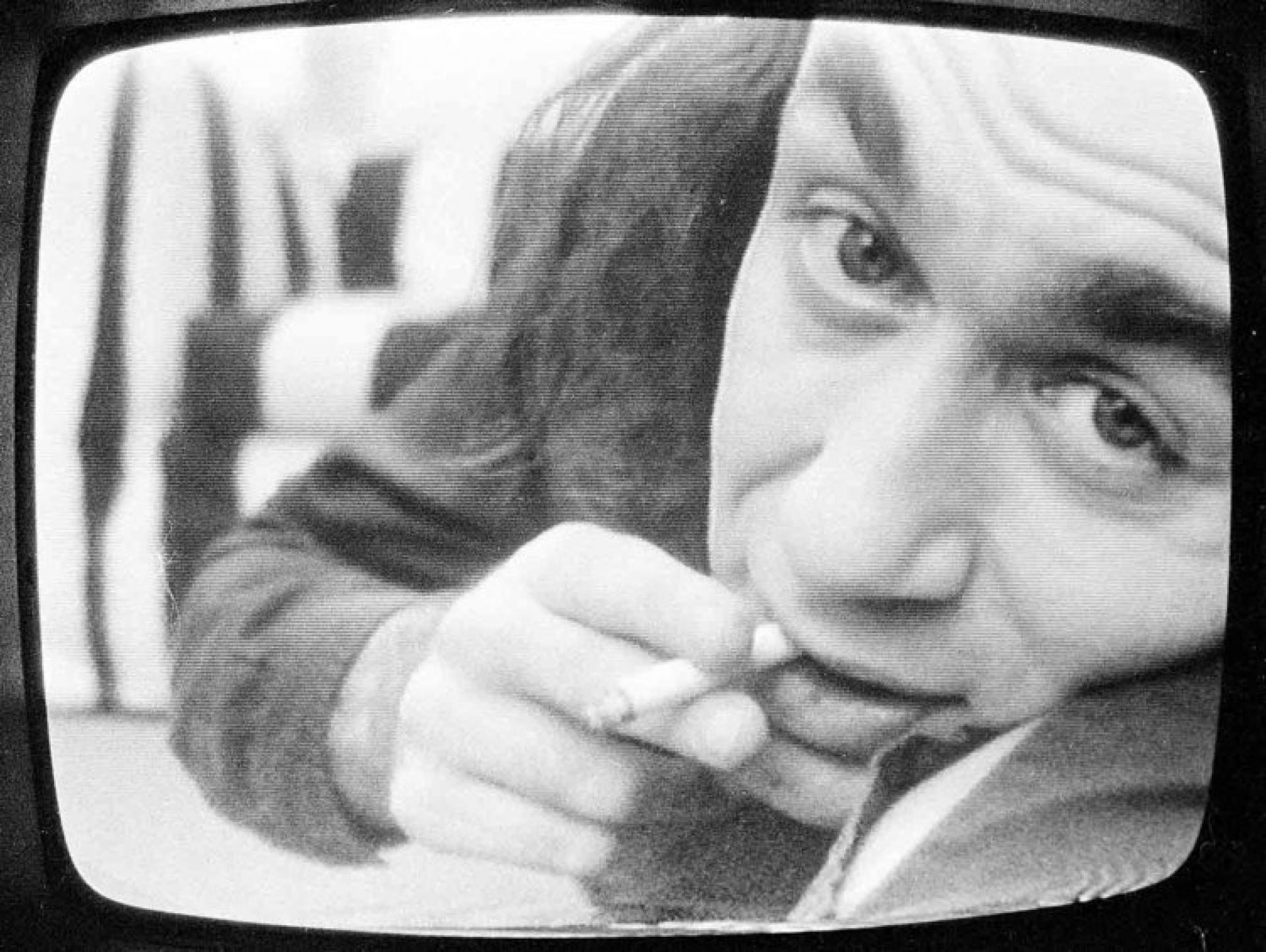Acconci’s confessional films portray his face larger than life and soft whispers. The viewer joins an interior with the work through Acconci, 1960s. | Photo via Acconci Studio