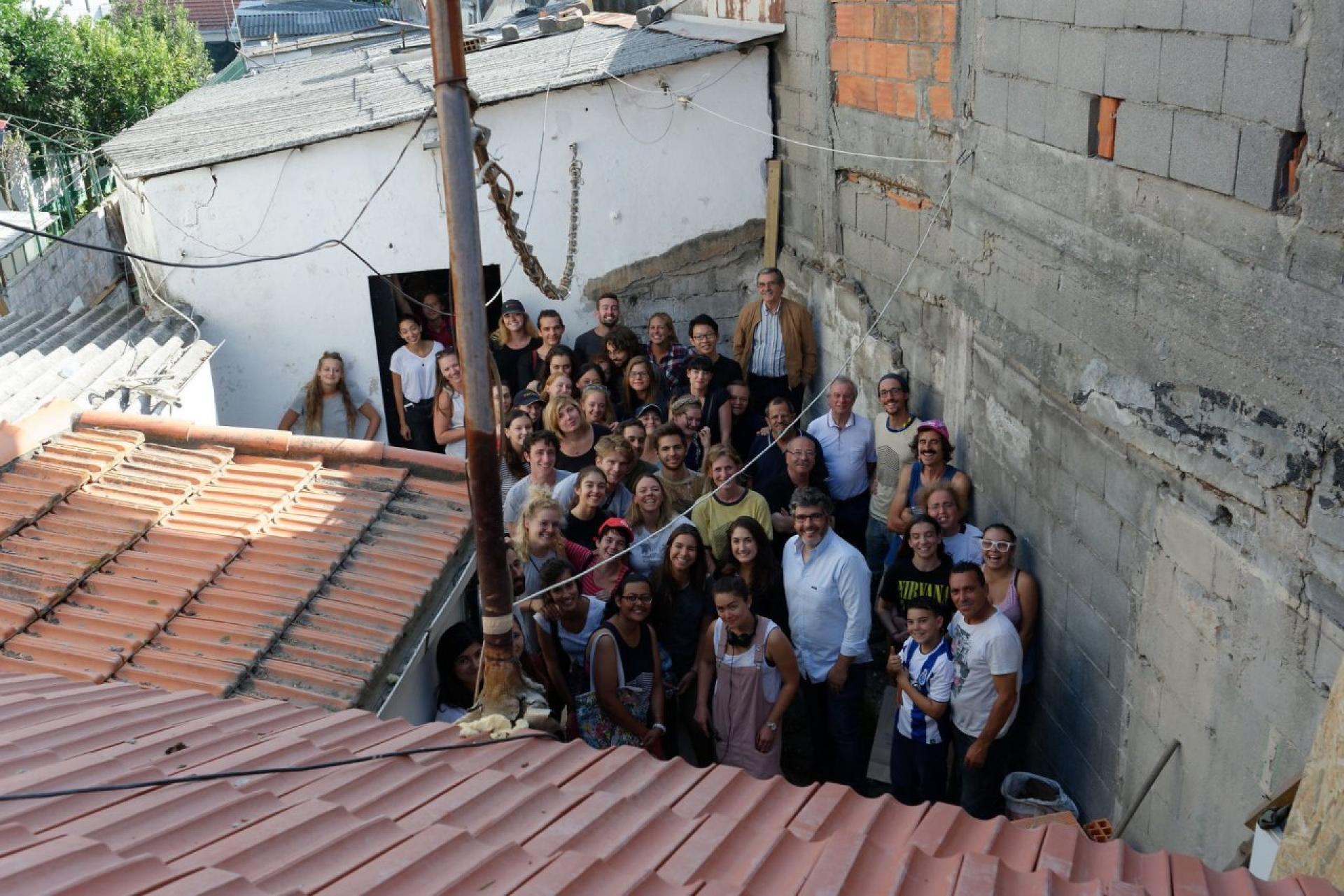 All participants in the backyard of renovated house. | Photo by Riccardo Bartali
