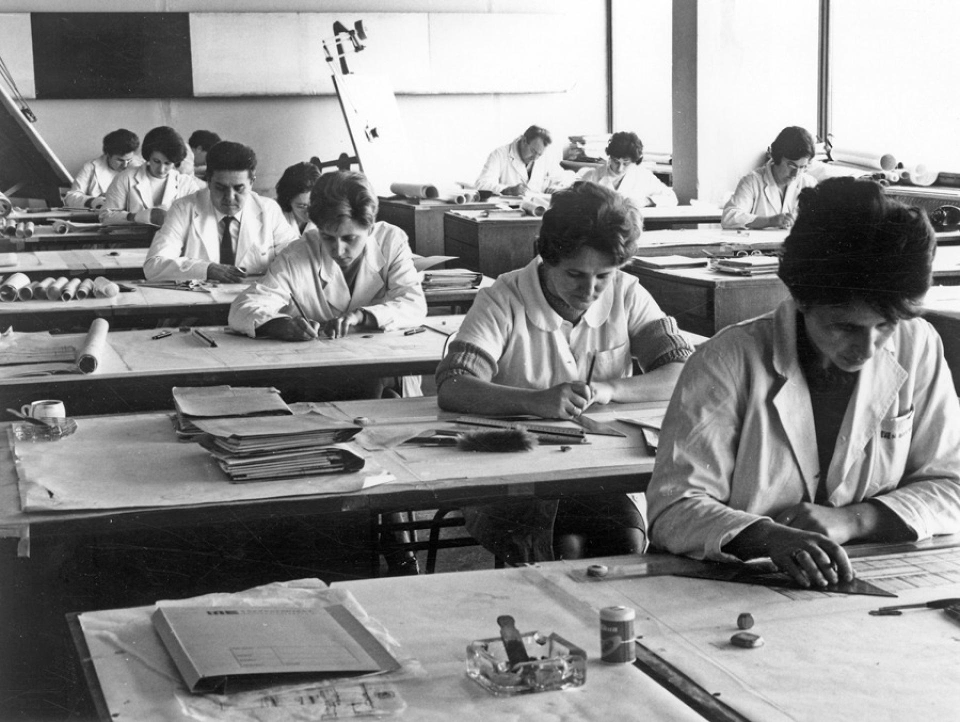 Male and female architects at work in the Department of Architecture and Urbanism at the headquarters of a major construction firm Energoprojekt in Belgrade. | Photo Courtesy Energoprojekt Archive