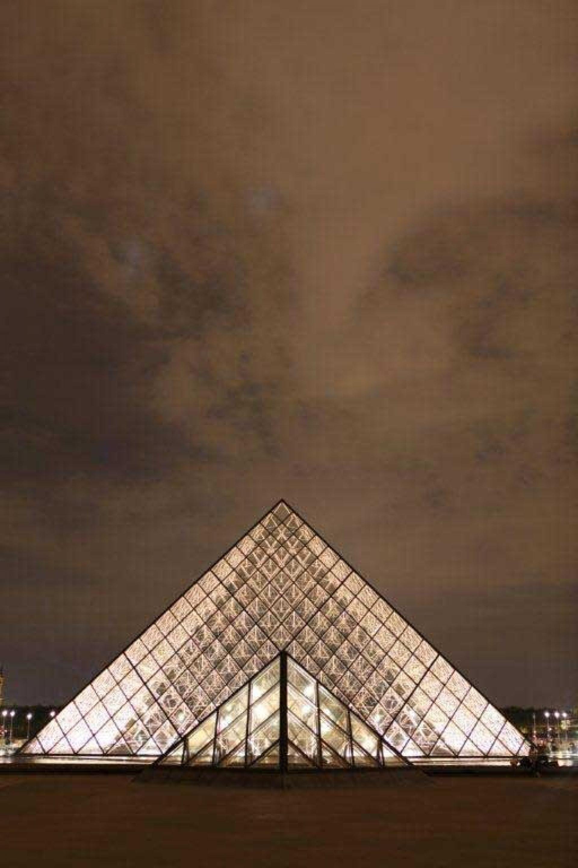 The Louvre pyramid is the main entrance to the Louvre Museum and has become a landmark of the city of Paris. | Photo by Steven Powell
