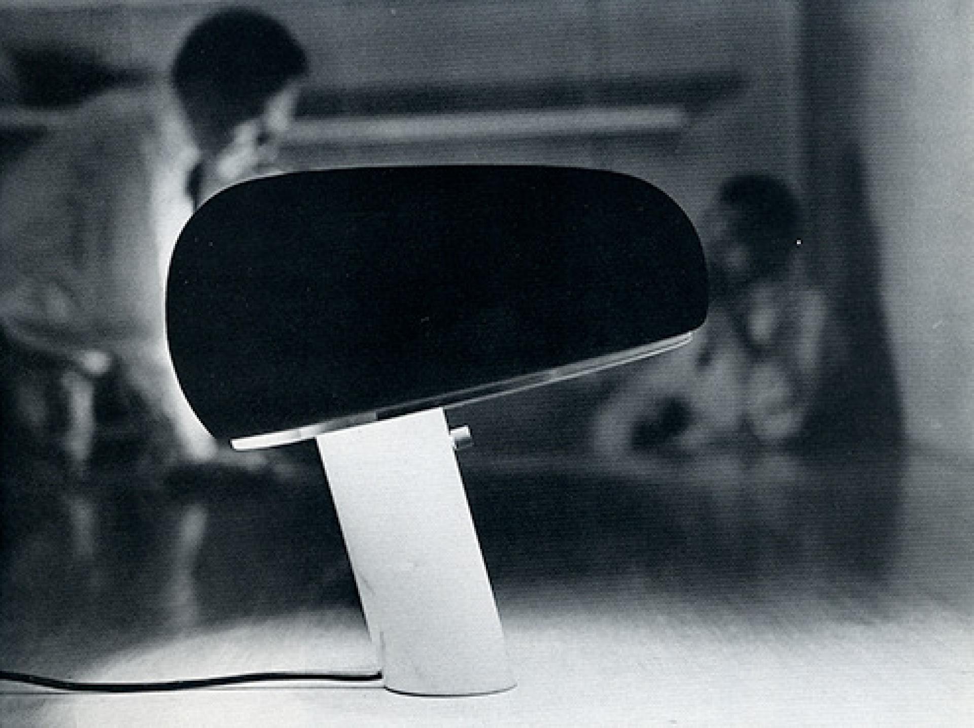 Snoopy lamp and Achille and Pier Giacomo Castiglioni at their studio in Corso Porta Nuova, 52. 1967 | Photo via 3nta