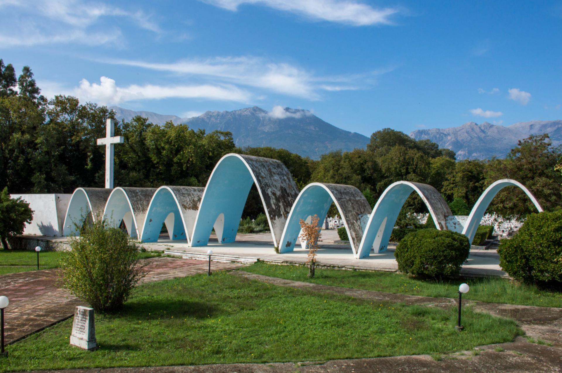 The waveform of the Magoula Cemetery is symbolic of the up’s and downs we go through life. | Photo by Exporabilia