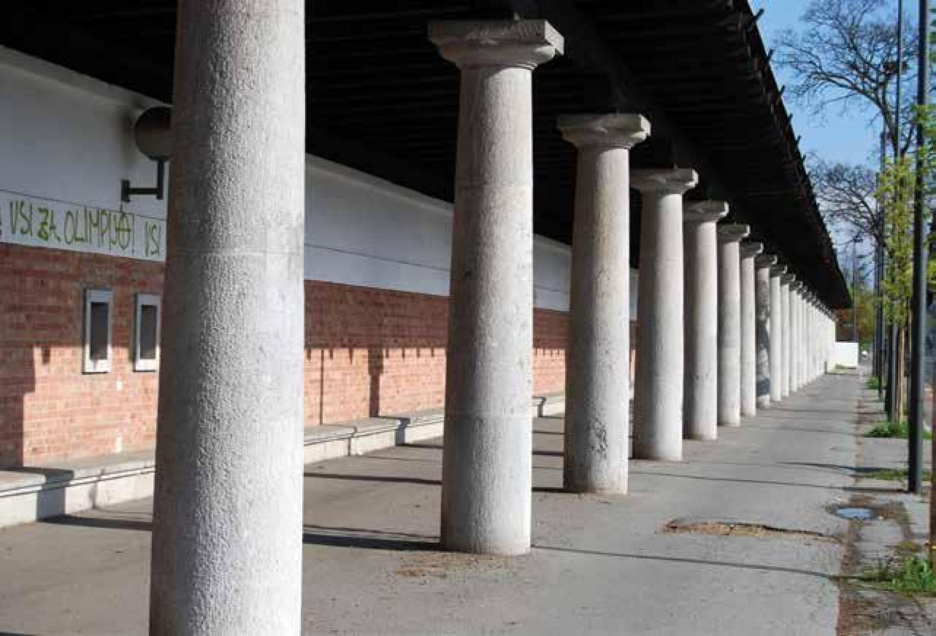 The monumental colonnade created a civic stoa or covered walkway that links the stadium enclosure with the city beyond as well as prviding for a covered space for people to queue. | Photo © Peter Krečič