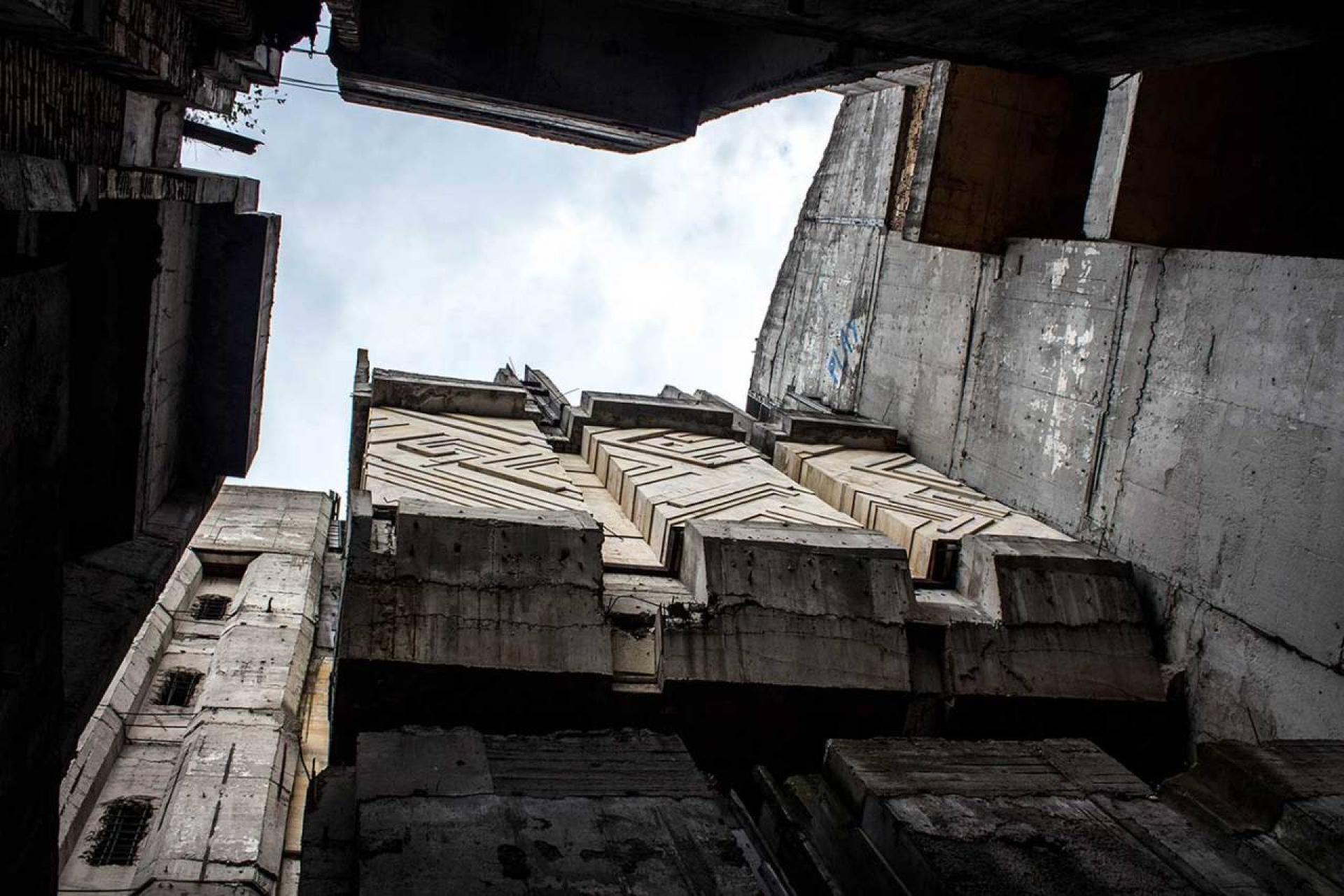 An upwards view, from deep within the abandoned construction site of the Central City Square concrete tower. | Photo © Darmon Richter