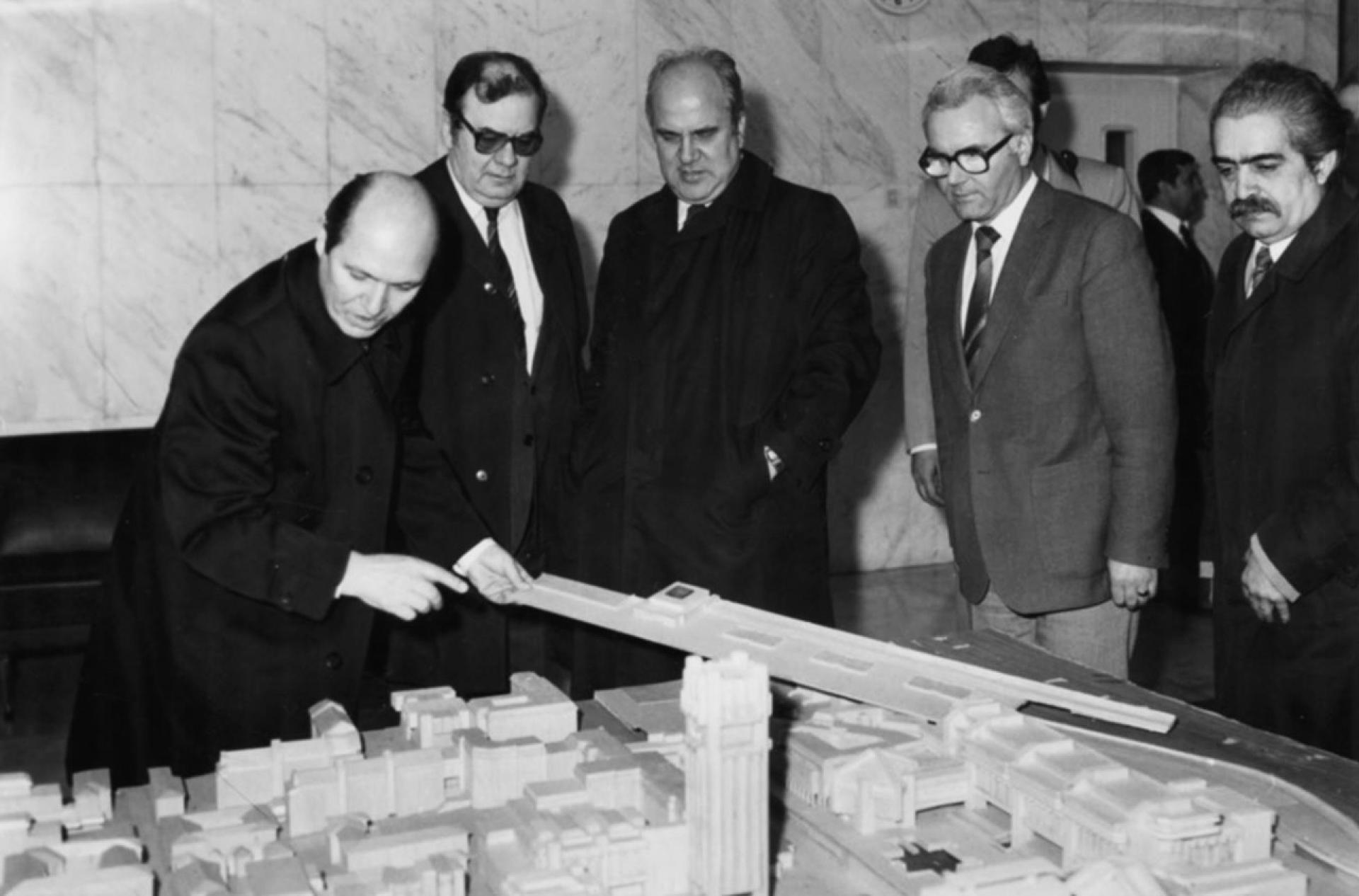 Ivan Sivrev (right) stands beside a model of Central City Square in 1988.